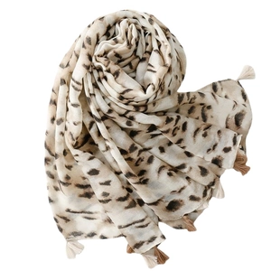 Elegant leopard print cotton linen feel scarf with delicate fringe tassels on white background
