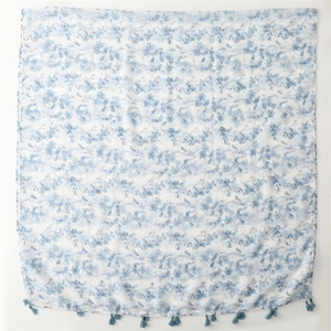 Light blue floral cotton linen scarf with tassel fringe on a white background