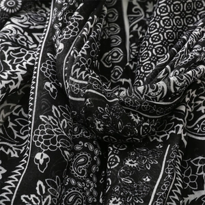Detailed view of paisley and floral print on soft breathable cotton-linen scarf fabric
