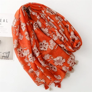 Orange floral cotton linen scarf with elegant tassels and lightweight summer shawl design