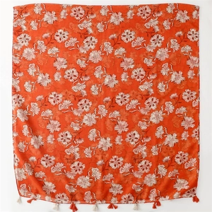 Orange floral cotton linen scarf with tassel fringe for women on white background