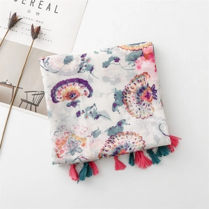 Detail of vintage floral print scarf with soft fringe tassels and paisley patterns