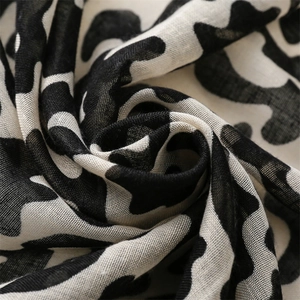 Minimalist black and white cow print cotton linen scarf with soft fringe texture