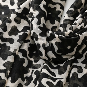 Macro detail of breathable cotton-linen fabric with artistic black and white abstract print