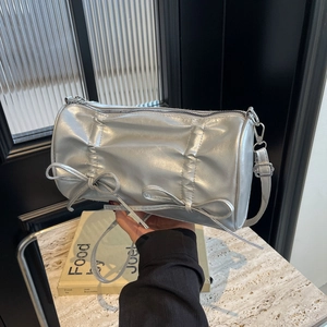 Silver pleated Boston bag with bow details and metallic finish shoulder strap