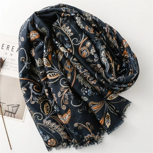 Navy blue paisley linen scarf with fringe edges and warm floral patterns