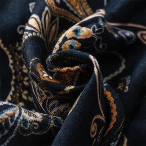 Macro shot of navy paisley cotton linen scarf with vintage bohemian floral patterns