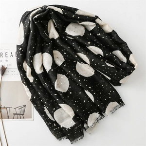 Elegant black scarf with white polka dots and gold foil details on cotton linen fabric