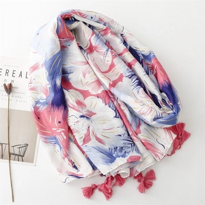 Elegant floral print cotton linen scarf with pink tassels and gold accents on white background