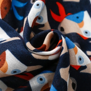 Detailed macro view of tropical toucan print on breathable cotton linen fabric scarf