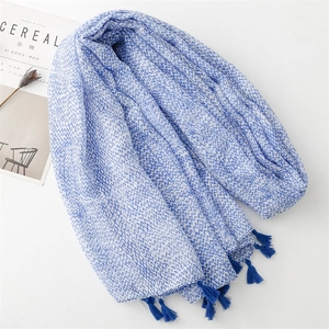 Blue and white wave pattern cotton linen scarf with tassels on white background