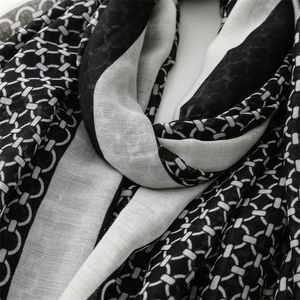 Detailed texture of black and white geometric chain pattern on lightweight linen scarf