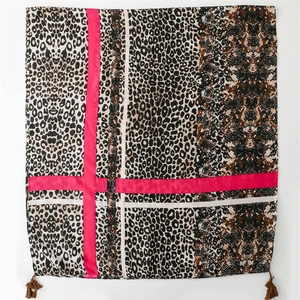 Soft leopard and snake print shawl with rose pink stripes and tassel details