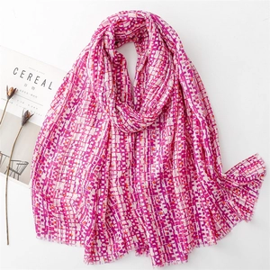 Pink and white pixel grid scarf with fringe edges and cotton linen feel for women
