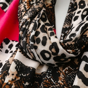 Close-up of pink leopard print cotton scarf showing soft texture and fine fabric weave