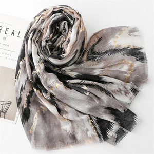 Detail of cotton linen feel scarf with gold foil hearts and ink wash pattern
