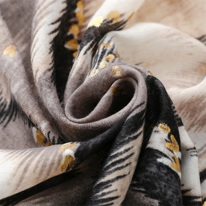 Detailed view of leopard print cotton linen scarf with gold heart foil stamping accents
