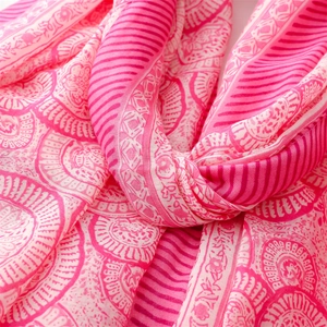 Close-up of pink lotus mandala pattern on a soft linen feel scarf with delicate textures