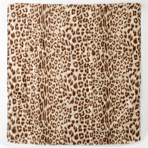 Detailed view of leopard print scarf with soft cotton-linen texture and frayed edges