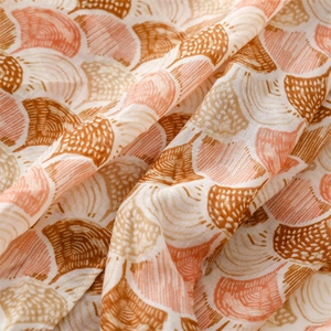 Detail of soft cotton linen shawl with colorful shell print and natural drape texture