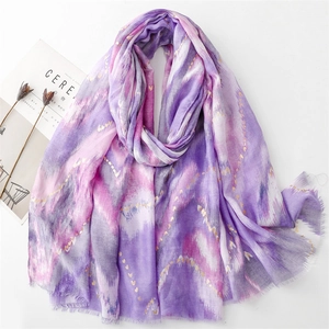 Detailed texture of cotton linen scarf with purple gradient and gold foil dot accents