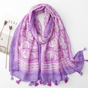 Detail of bohemian purple mandala print scarf with soft tassels and cotton linen texture