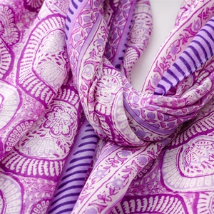 Detailed view of purple lotus mandala print cotton linen scarf with soft fringe texture