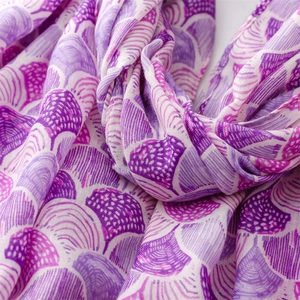 Close-up of purple shell pattern printed scarf with soft cotton linen texture details