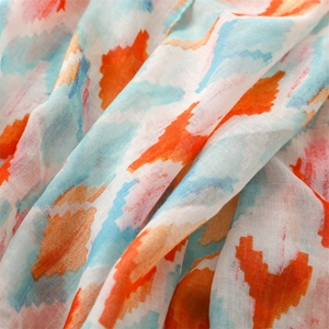 Macro detail of lightweight colorful geometric print fabric for summer scarf and shawl