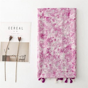 Floral print shawl scarf in pink and purple watercolor with elegant fringe tassels