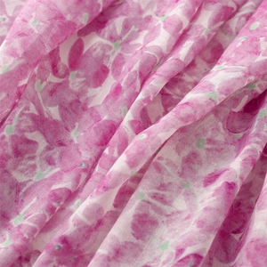 Macro detail of breathable pink floral fabric texture with light semi-sheer linen feel
