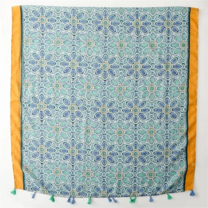 Ethnic bohemian scarf with blue-green mandala patterns and orange borders with tassels