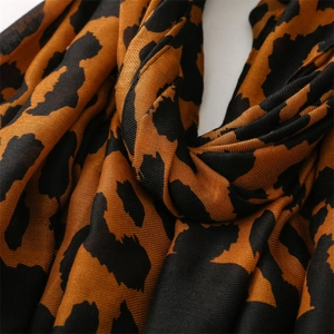 Macro detail of twill weave fabric texture on leopard print pashmina shawl