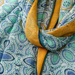 Close-up of bohemian scarf showing detailed mandala patterns and soft cotton-linen texture