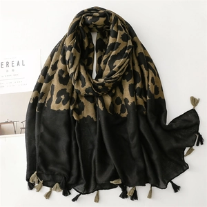 Macro detail of leopard print scarf with soft cotton-linen feel and stylish fringe