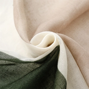 Detailed view of breathable cotton-linen scarf fabric with green geometric color block