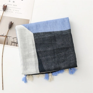 Close-up of lightweight cotton linen scarf with geometric color block and fringe trim
