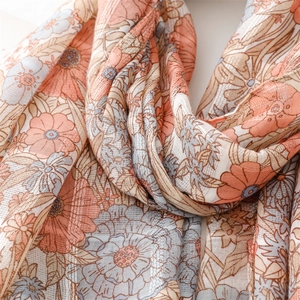Close-up of vintage floral cotton linen scarf with soft texture and metallic silver thread