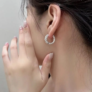 Elegant silver wheat grain hoop earrings with a textured weave design for a minimalist look