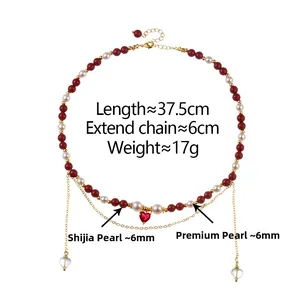 Detail showing 37.5cm red bead and pearl necklace with a red heart pendant and gold clasp