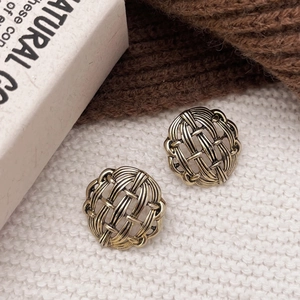 Retro hollow geometric round stud earrings with gold plating and woven metal texture