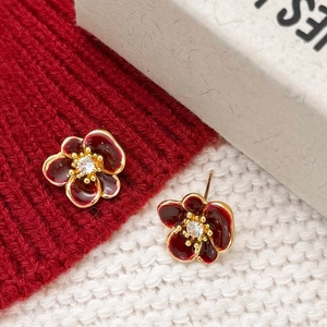 Elegant gold-plated flower earrings with dark red enamel petals and a central white zircon