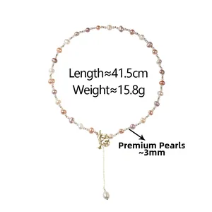Detail of 3mm natural freshwater pearl necklace with gold irregular pendant and specs