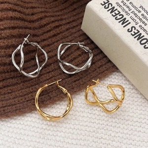 Minimalist irregular hollow geometric hoop earrings in polished gold and silver finishes