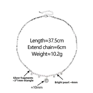 Detail of silver nugget chain with pearls and a sparkling crystal diamond pendant
