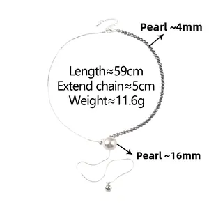 Macro detail of pearl stitching necklace with silver chain and white pendant drop