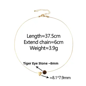 Detail of tiger eye stone bead and gold heart pendant necklace with precise dimensions