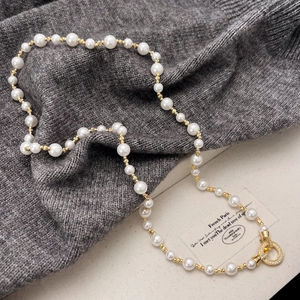 French vintage pearl necklace with gold beads and sparkling rhinestone circle clasp