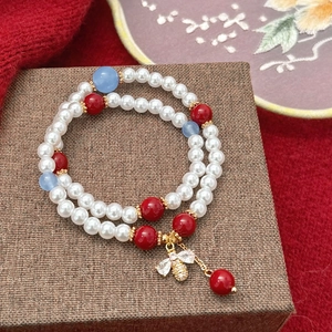 Double-layer pearl bracelet with red agate beads and golden crystal bee pendant
