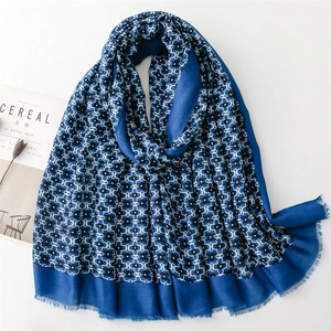Elegant Klein blue geometric chain print shawl with fringe details on white background